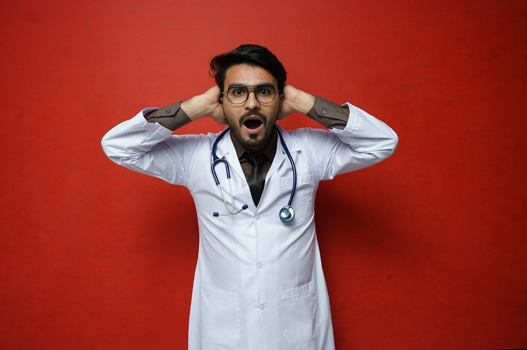 Studio portrait of a man methodologist with glasses