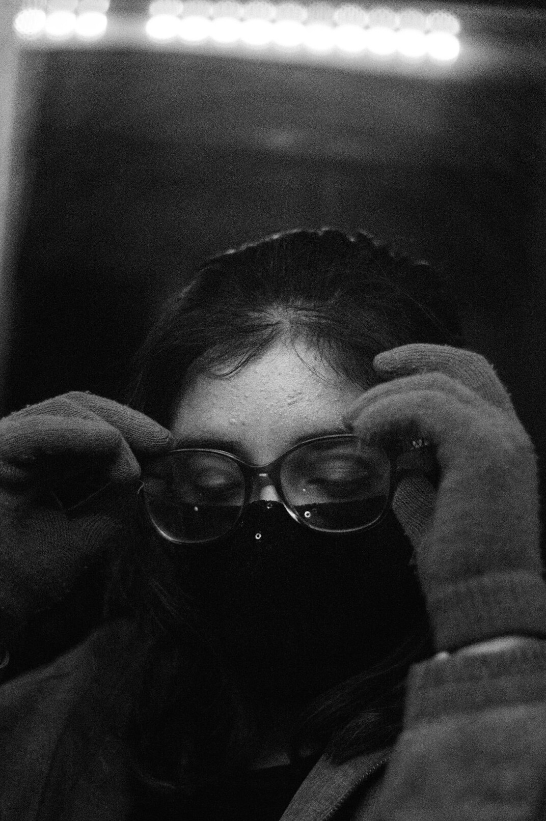 Studio portrait of a woman researcher with glasses